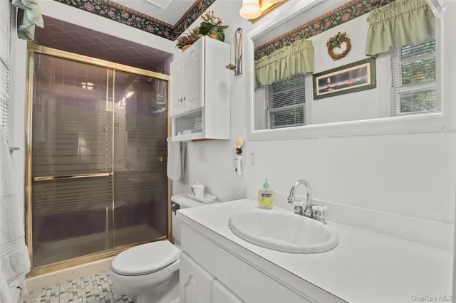 a view of a chairs and table on the wooden deck