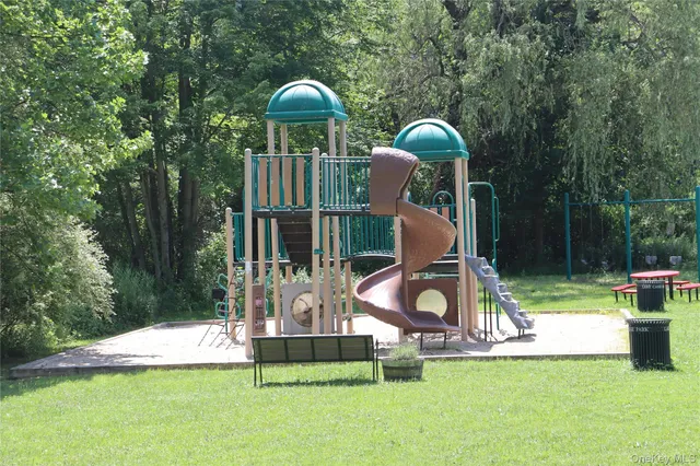 a view of a park with large trees