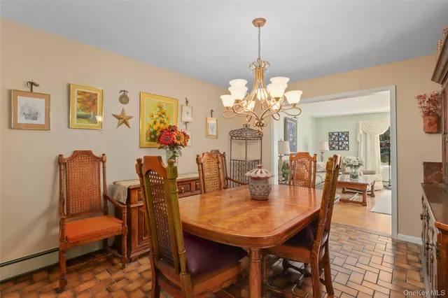 a living room with fireplace furniture and a large window