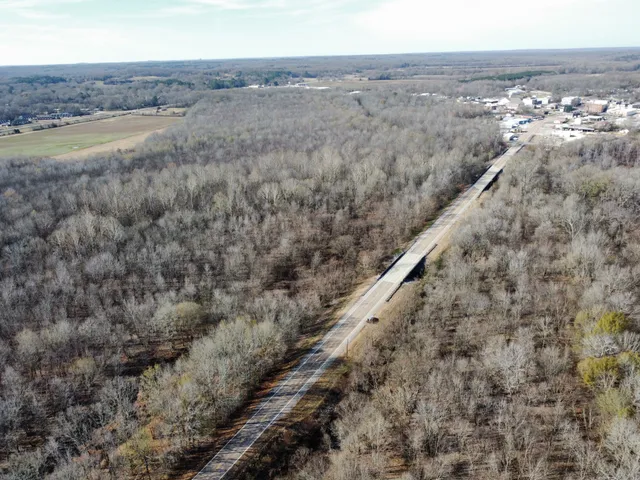 an aerial view of house with yard