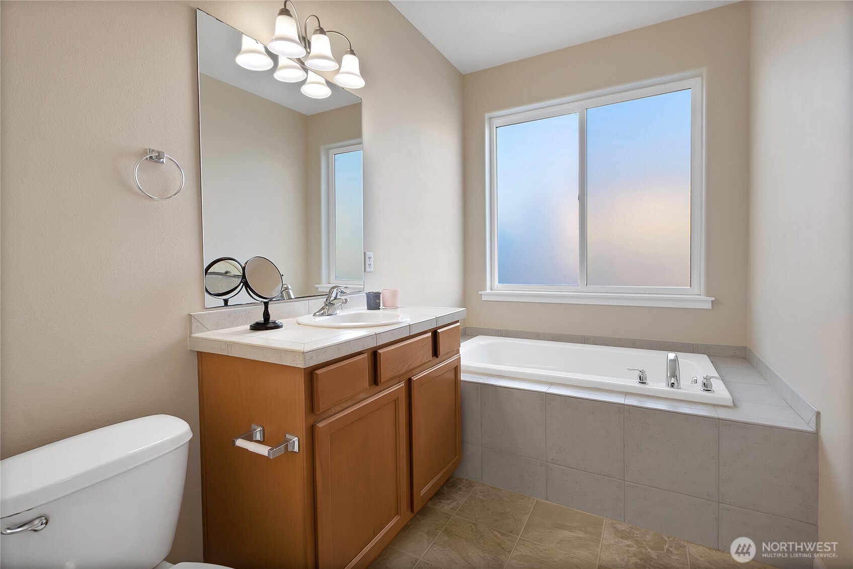 509 Balmer Street Southwest Orting, WA 98360 - Photo 11 of 22 a bathroom with a sink a toilet and a bathtub