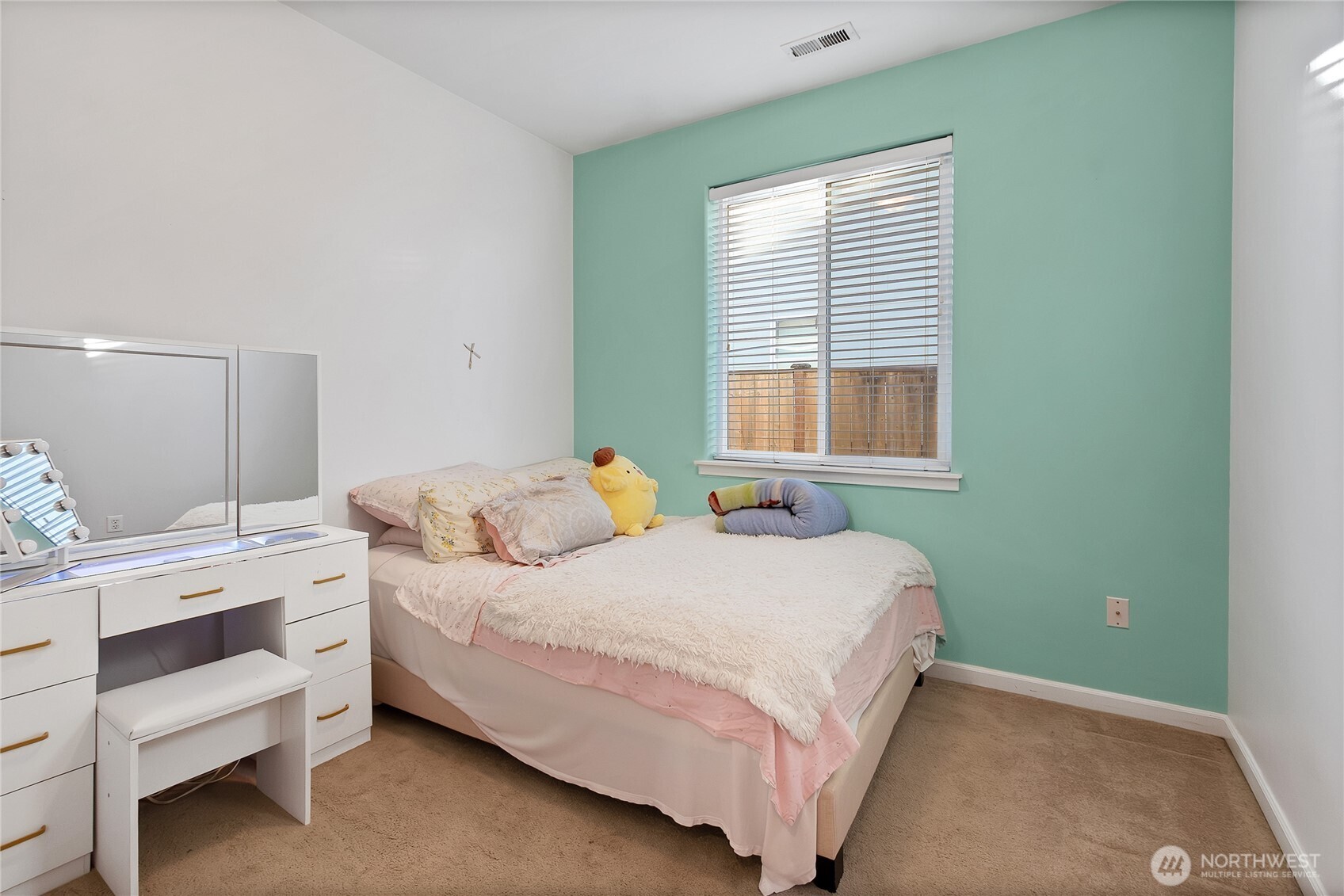 509 Balmer Street Southwest Orting, WA 98360 - Photo 13 of 22 a bedroom with a bed and a window