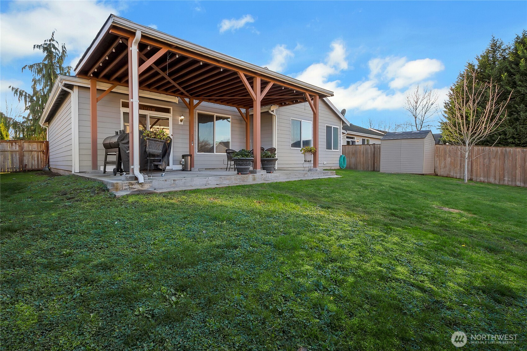 509 Balmer Street Southwest Orting, WA 98360 - Photo 17 of 22 a view of a house with a yard and sitting area