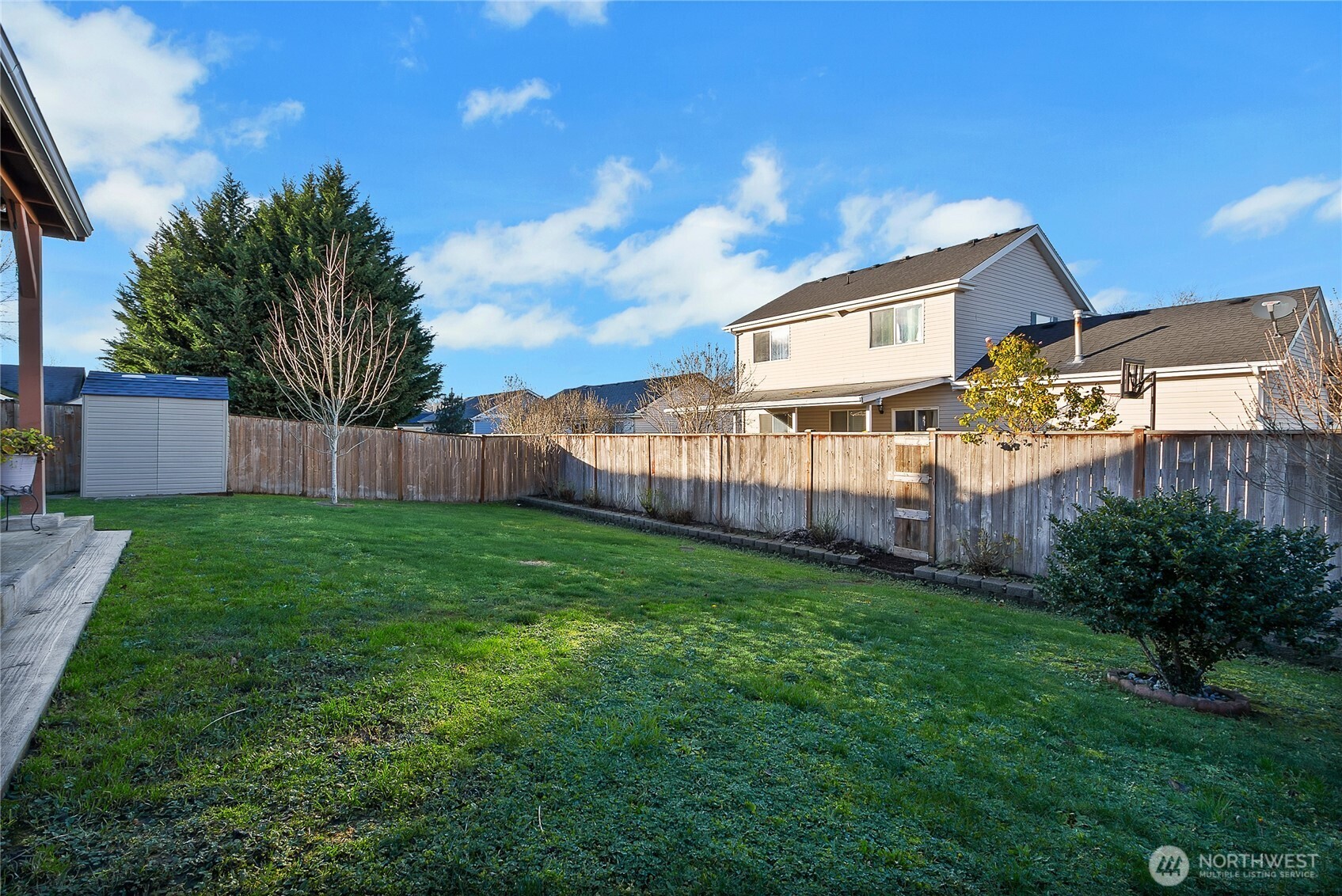 509 Balmer Street Southwest Orting, WA 98360 - Photo 18 of 22 a view of a house with backyard and garden