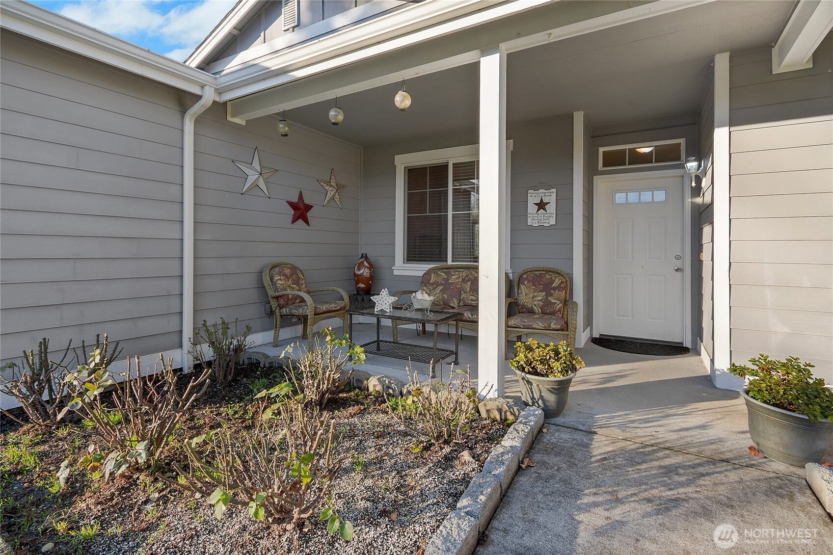 509 Balmer Street Southwest Orting, WA 98360 - Photo 3 of 22 a front view of a house with patio