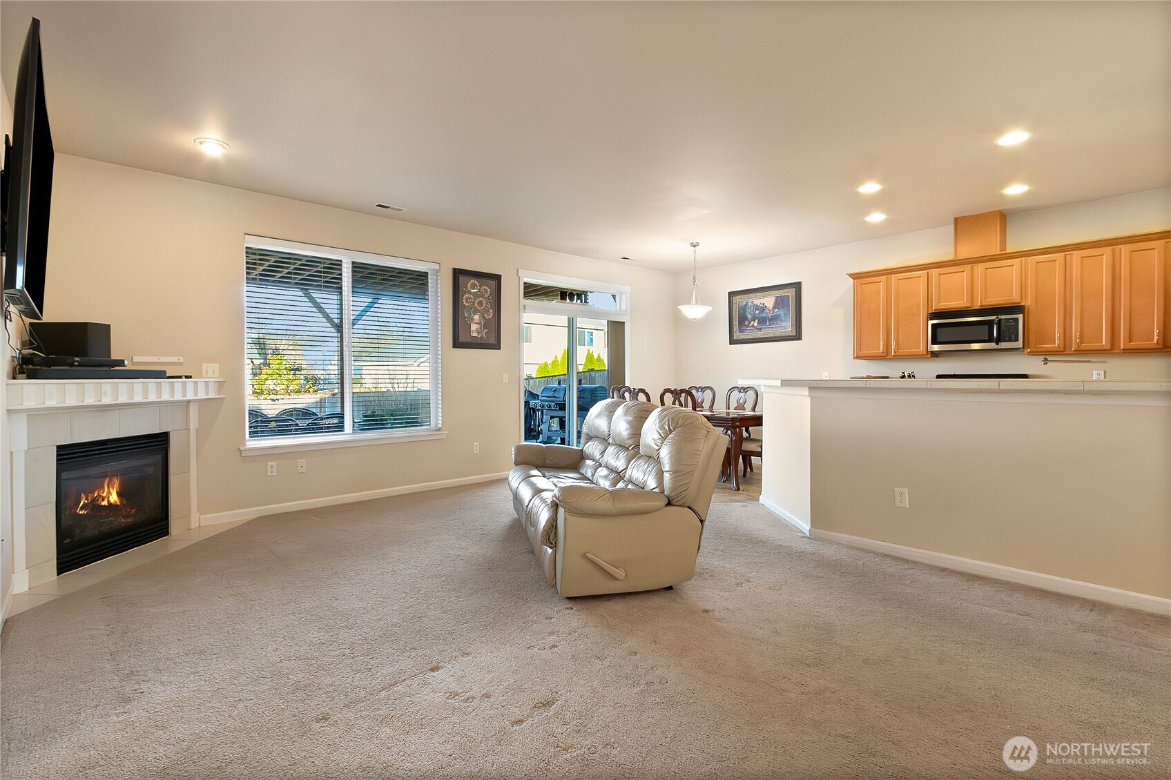 509 Balmer Street Southwest Orting, WA 98360 - Photo 4 of 22 a living room with furniture and a fireplace