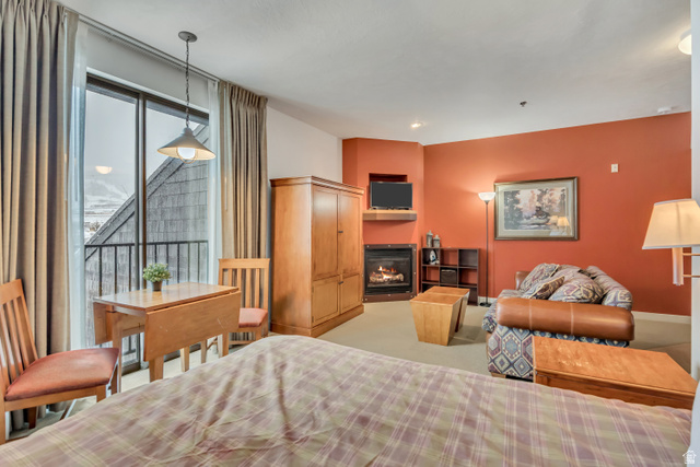 1364 Still Water Drive, Unit R3005 Heber City, UT 84032 - Photo 5 of 28 Bedroom with a glass covered fireplace and access to outside