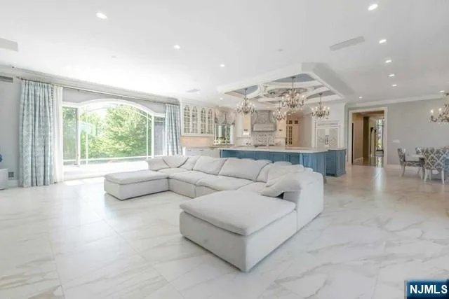 a view of a garden with a table and chairs under an umbrella