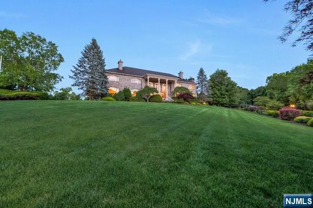 a living room with furniture kitchen view and a large window