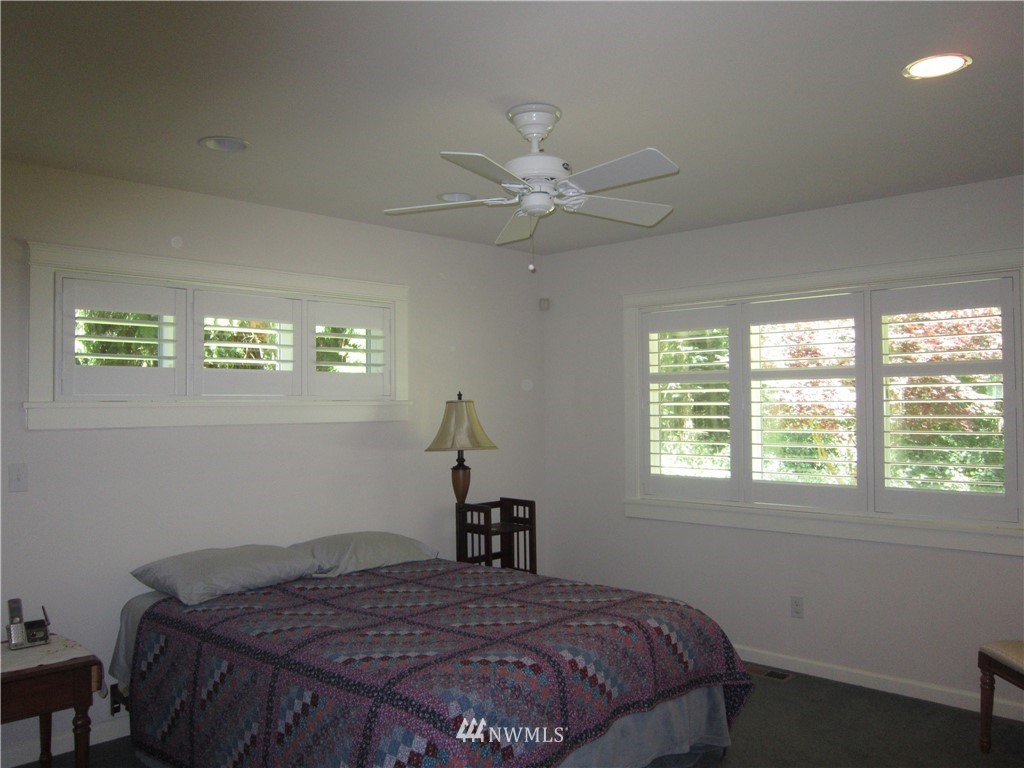3540 7075 South Clinton, WA 98236 - Photo 11 of 25 a bedroom with a bed and a window