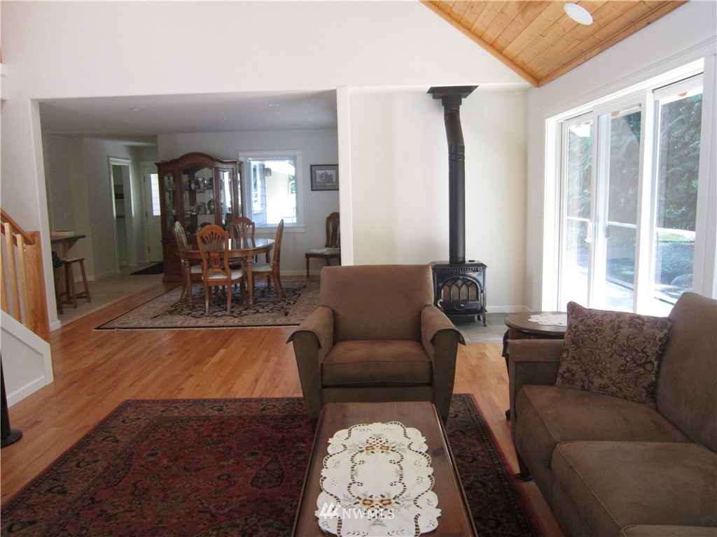 3540 7075 South Clinton, WA 98236 - Photo 8 of 25 a living room with furniture and large windows