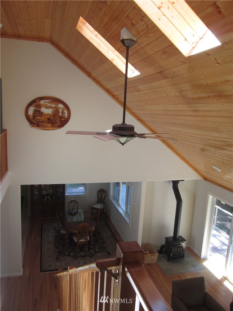 3540 7075 South Clinton, WA 98236 - Photo 9 of 25 a view of a livingroom with furniture and floor to ceiling window