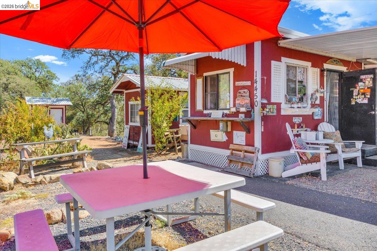 14450 Jacksonville Road Jamestown, CA 95327 - Photo 63 of 85 Red exterior structure with white window trim and shutters