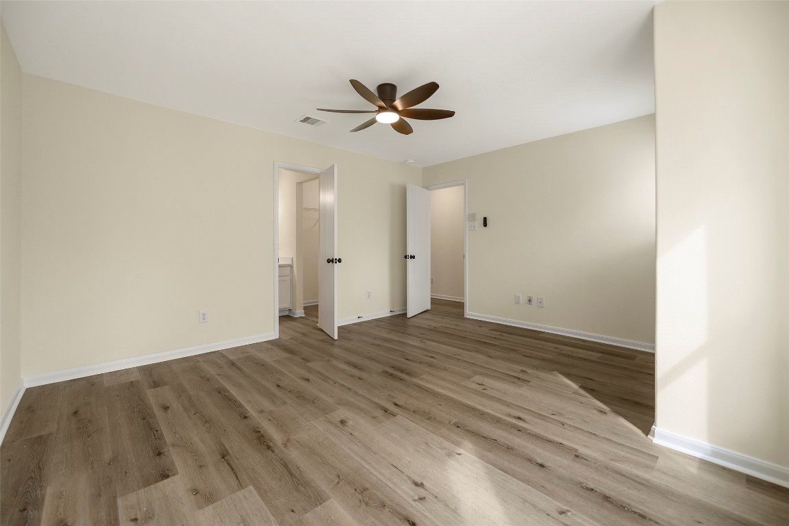 13226 Ridgewood Knoll Lane Houston, TX 77047 - Photo 20 of 37 a view of empty room with wooden floor