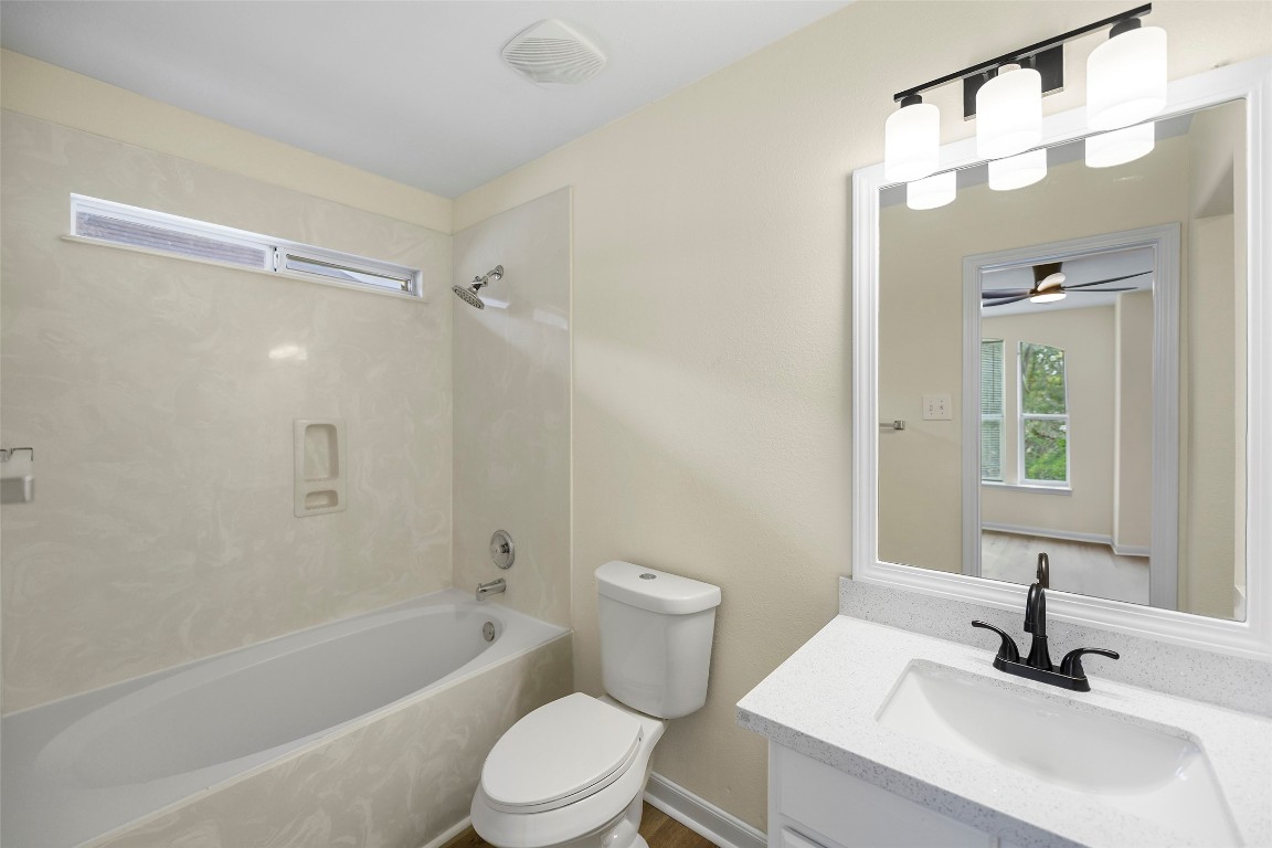 13226 Ridgewood Knoll Lane Houston, TX 77047 - Photo 21 of 37 a bathroom with a sink a toilet and shower