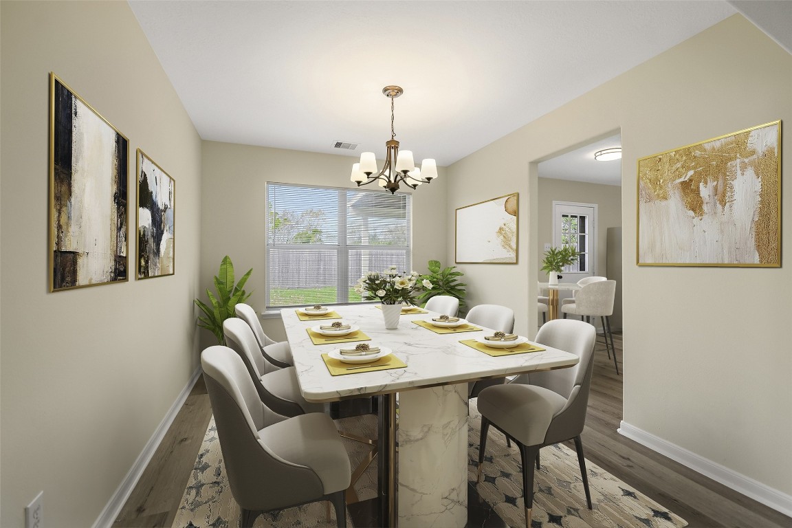 13226 Ridgewood Knoll Lane Houston, TX 77047 - Photo 3 of 37 a view of a dining room with furniture and chandelier