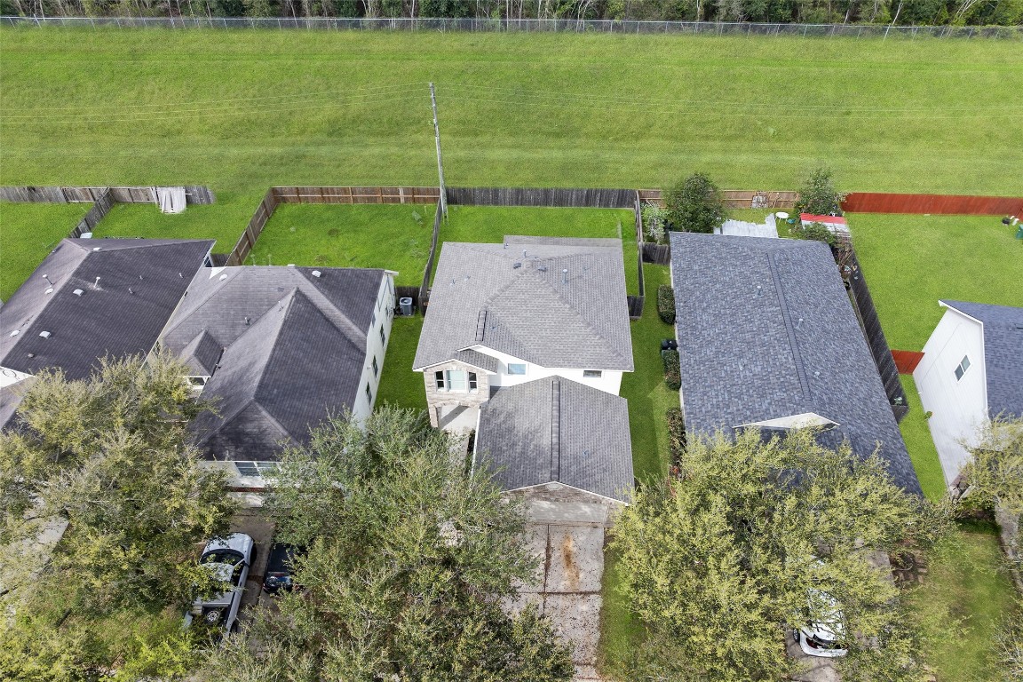 13226 Ridgewood Knoll Lane Houston, TX 77047 - Photo 35 of 37 an aerial view of a house with a garden and lake view