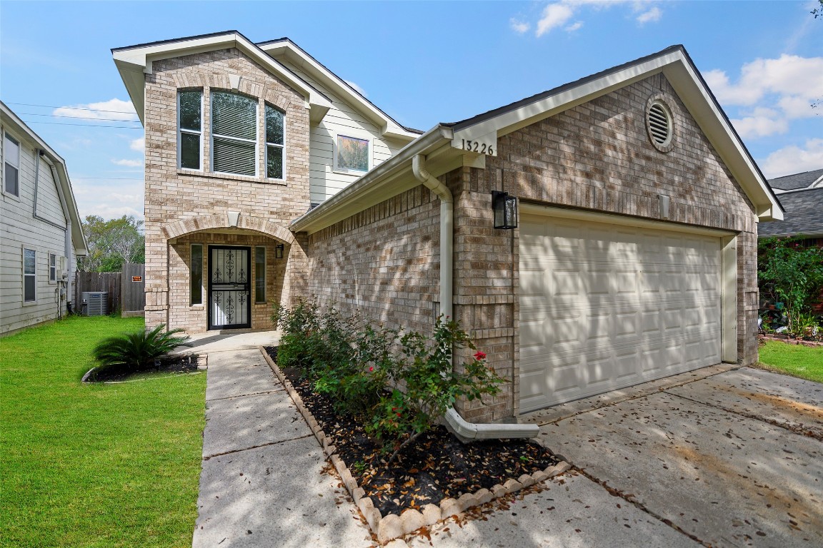 13226 Ridgewood Knoll Lane Houston, TX 77047 - Photo 37 of 37 a front view of a house with garden