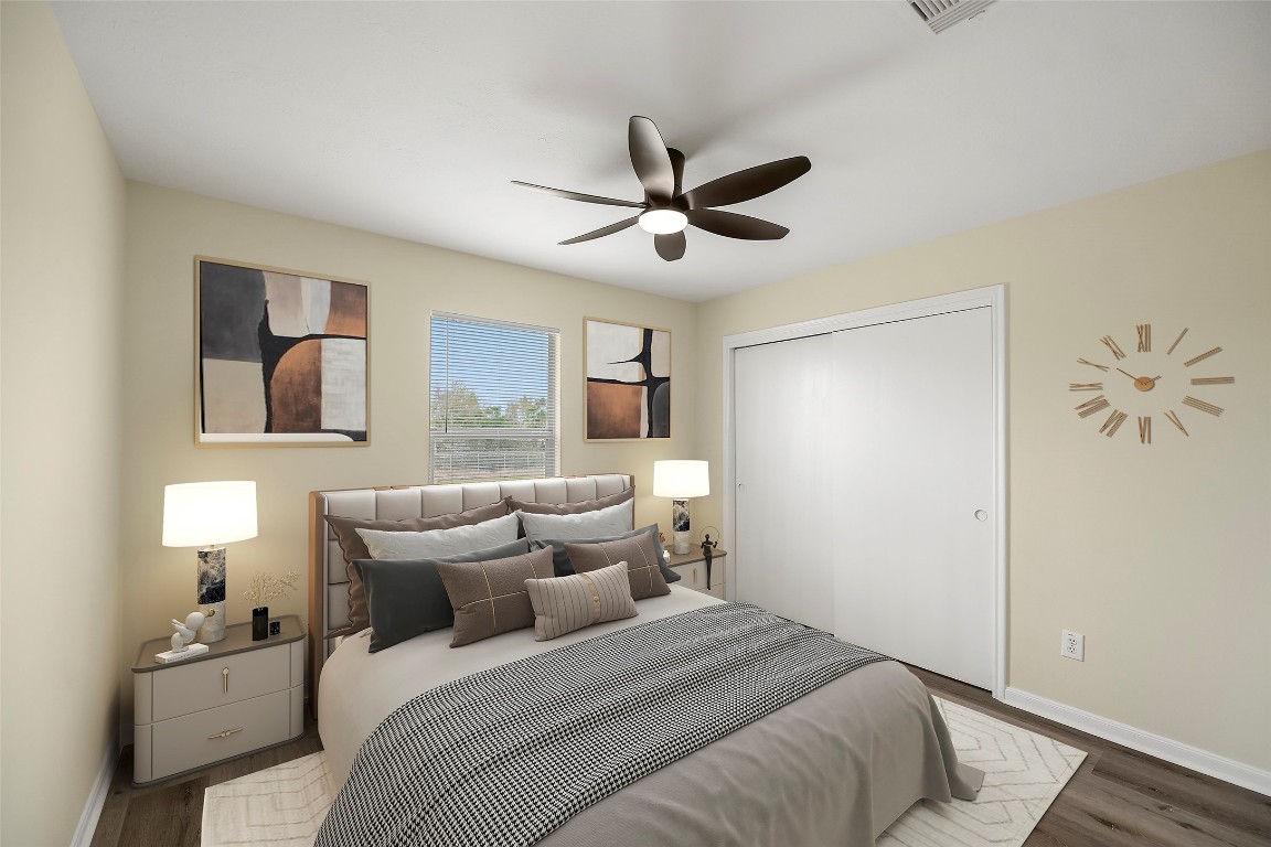 13226 Ridgewood Knoll Lane Houston, TX 77047 - Photo 7 of 37 a bedroom with a bed and a painting on the wall