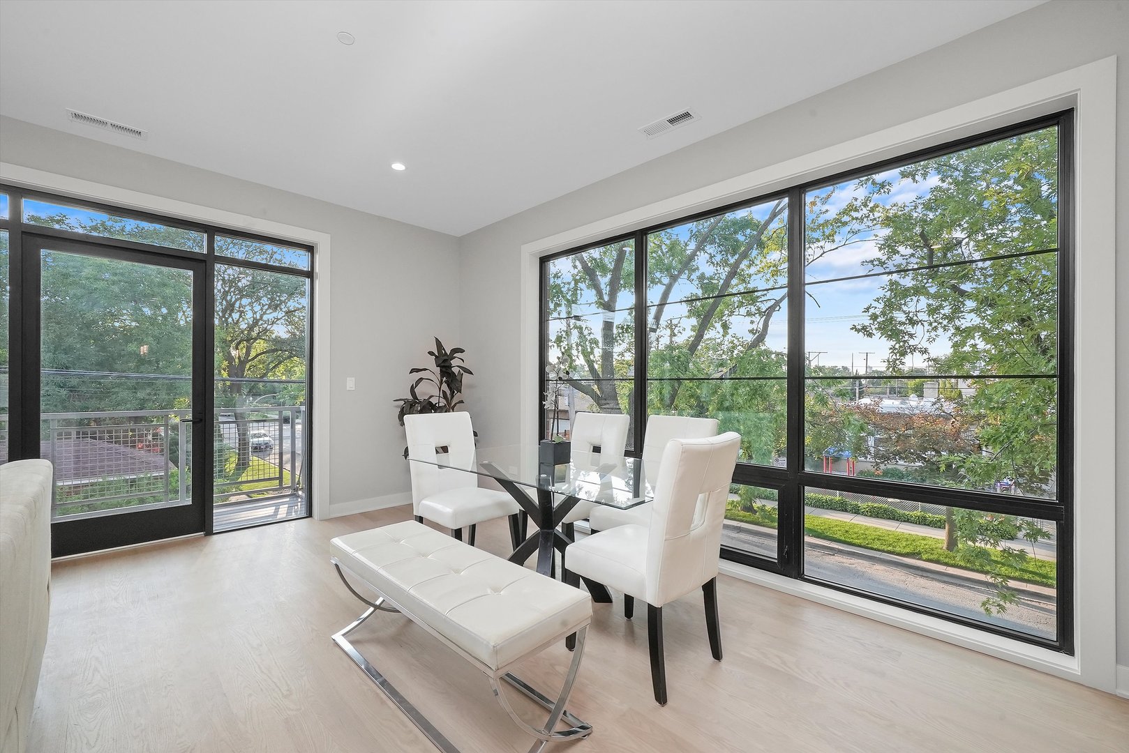 6246 North Pulaski Road, Unit 204 Chicago, IL 60646 - Photo 13 of 38 a living room with couch and large windows