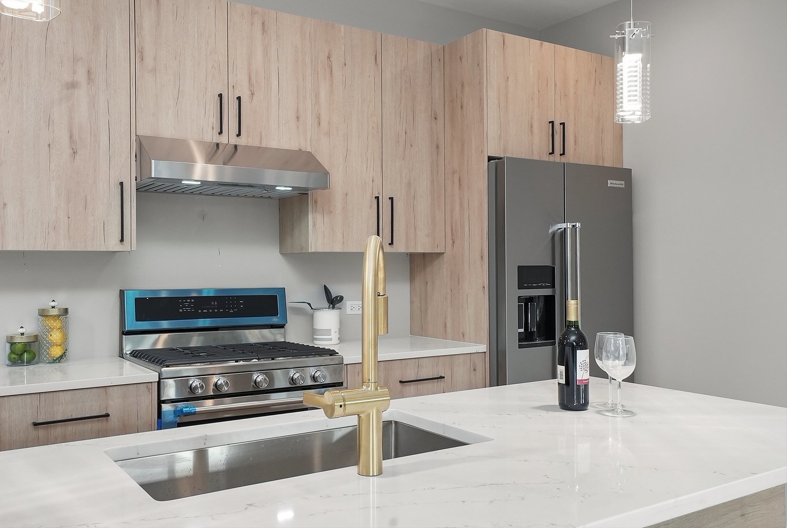 6246 North Pulaski Road, Unit 204 Chicago, IL 60646 - Photo 15 of 38 a kitchen with stainless steel appliances granite countertop a sink stove and refrigerator