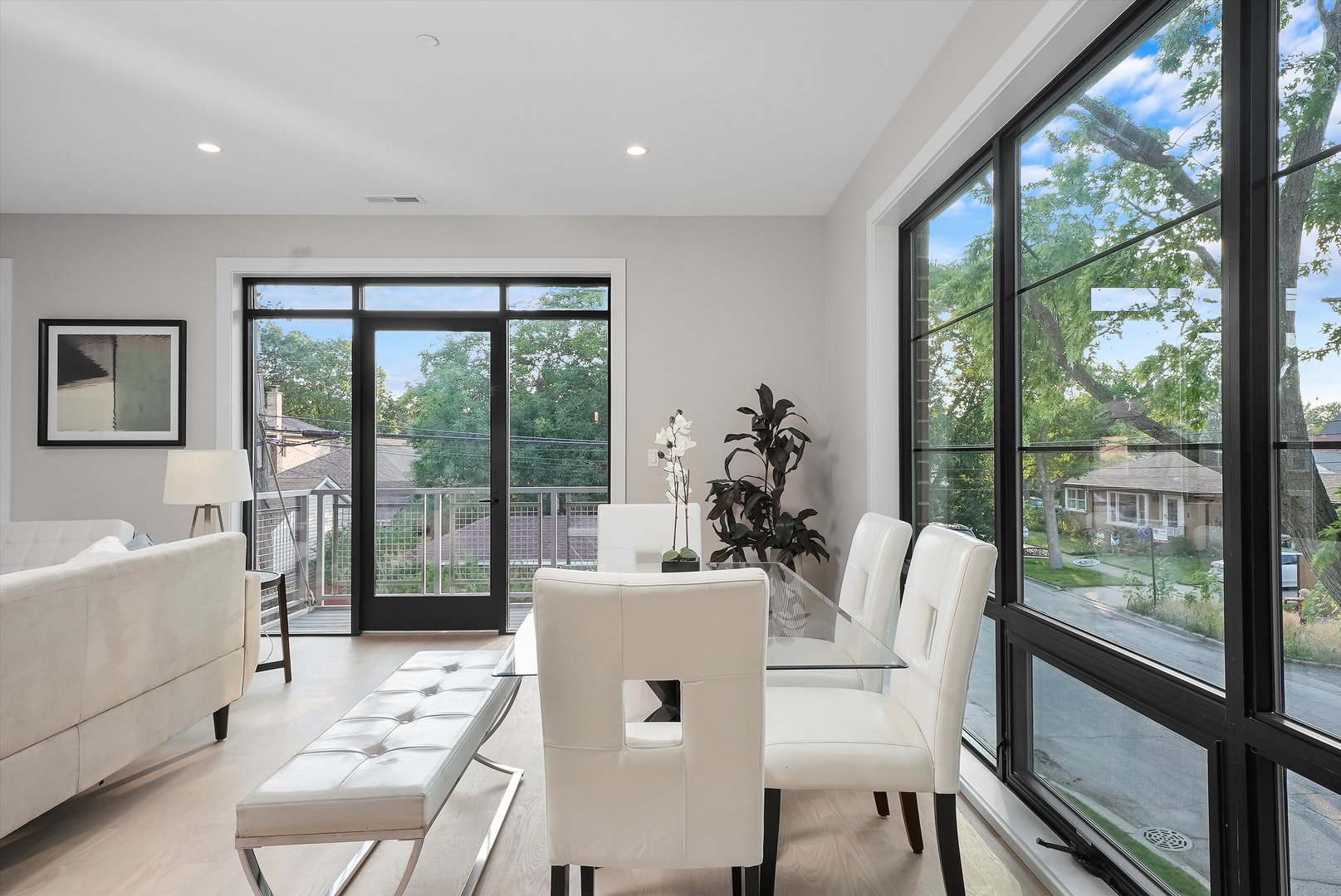 6246 North Pulaski Road, Unit 204 Chicago, IL 60646 - Photo 18 of 38 a dining room with furniture a chandelier and wooden floor