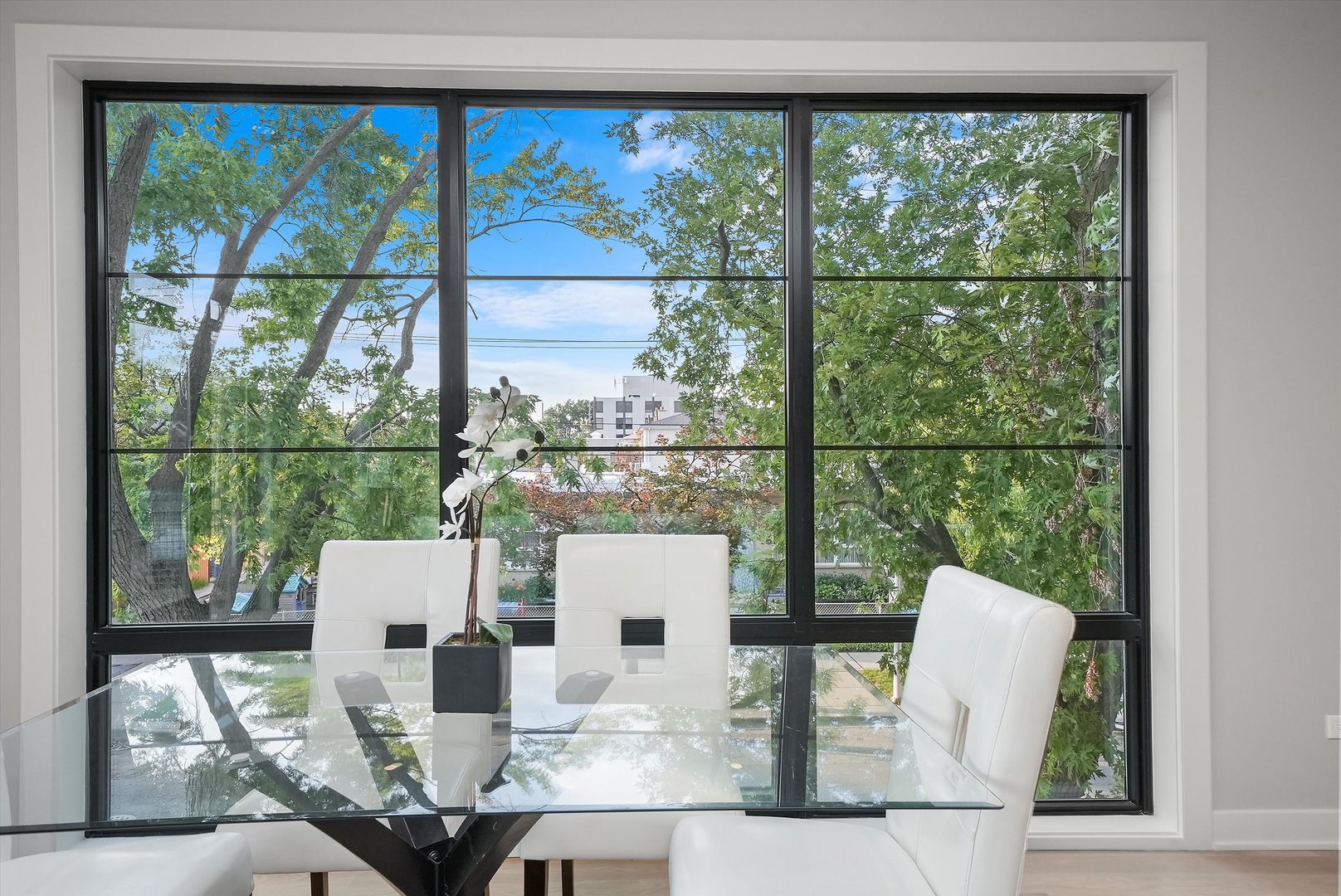 6246 North Pulaski Road, Unit 204 Chicago, IL 60646 - Photo 19 of 38 a living room with a large window and dining table