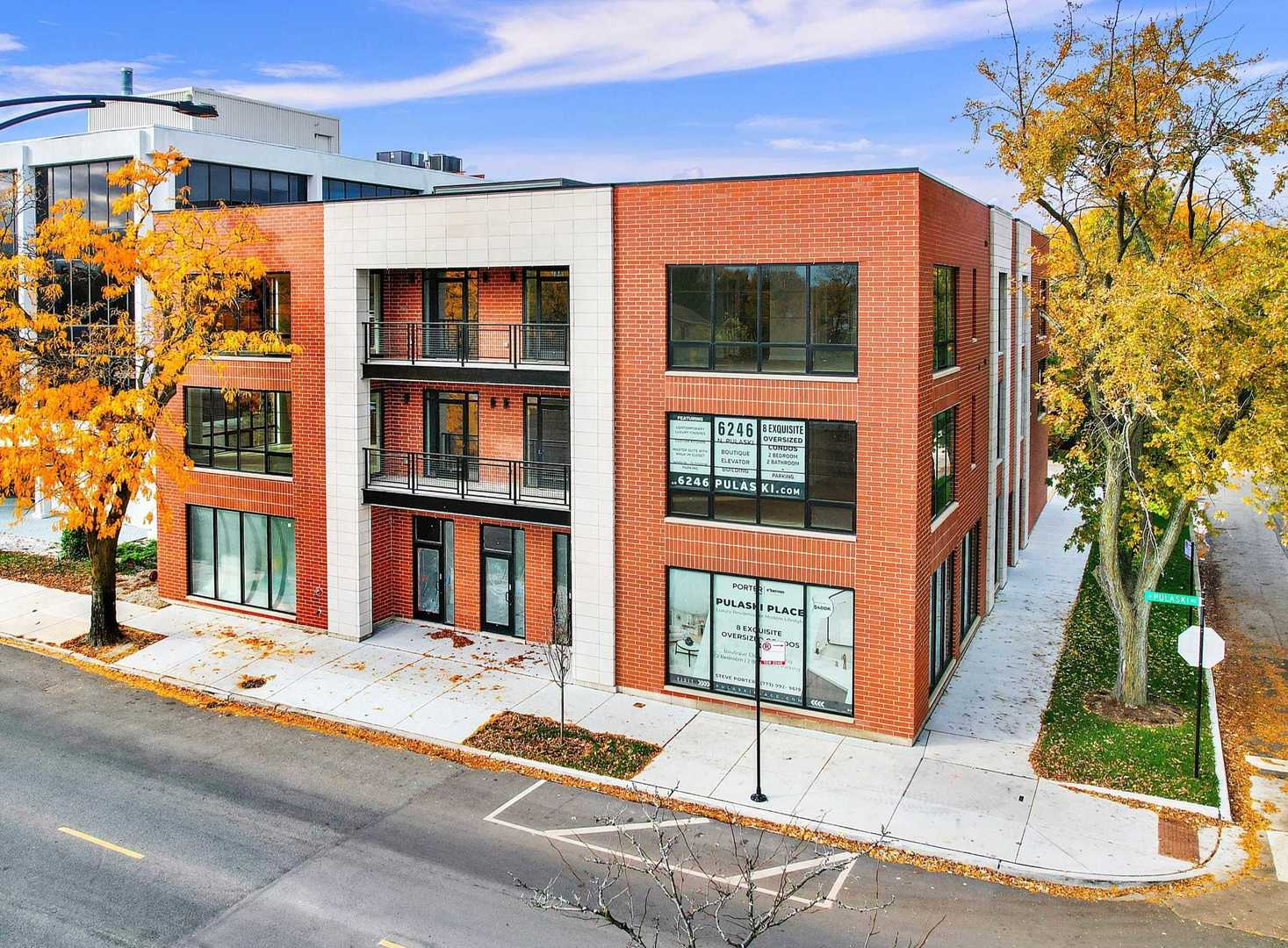 6246 North Pulaski Road, Unit 204 Chicago, IL 60646 - Photo 2 of 38 a front view of a building with a street
