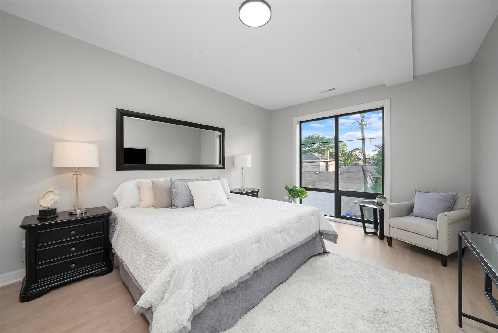 6246 North Pulaski Road, Unit 204 Chicago, IL 60646 - Photo 21 of 38 a bedroom with a bed and a couch