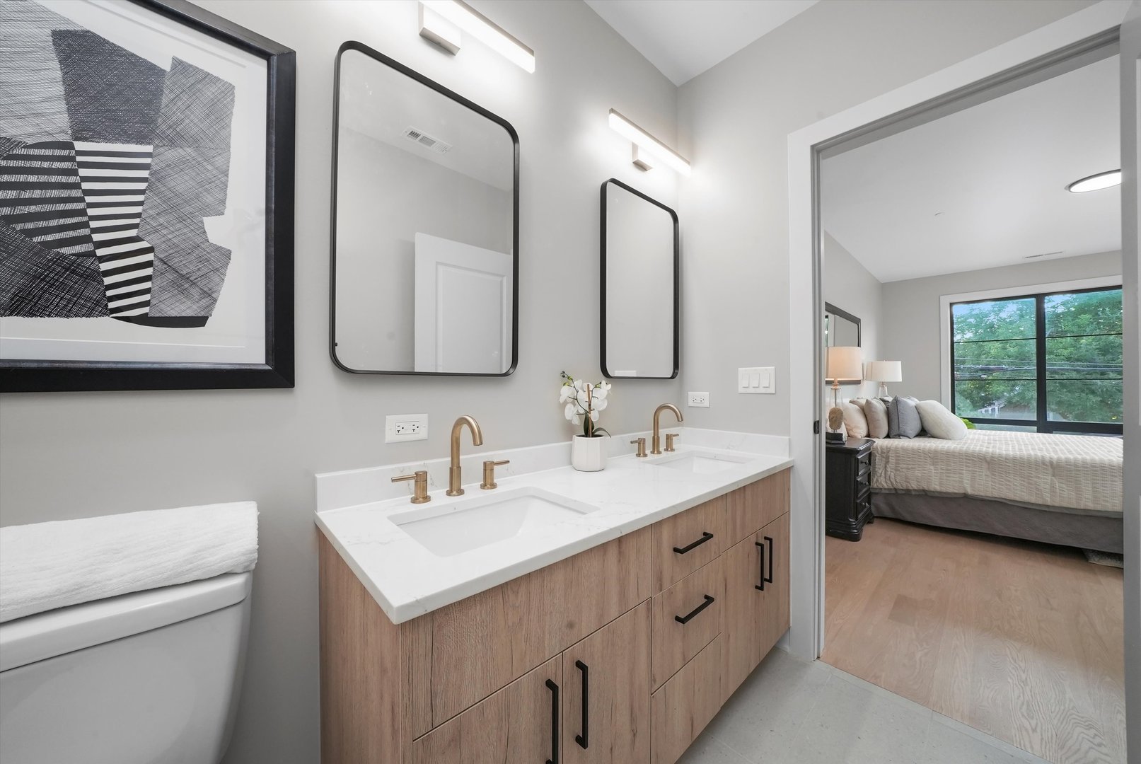 6246 North Pulaski Road, Unit 204 Chicago, IL 60646 - Photo 27 of 38 a bathroom with a double vanity sink mirror and bathtub