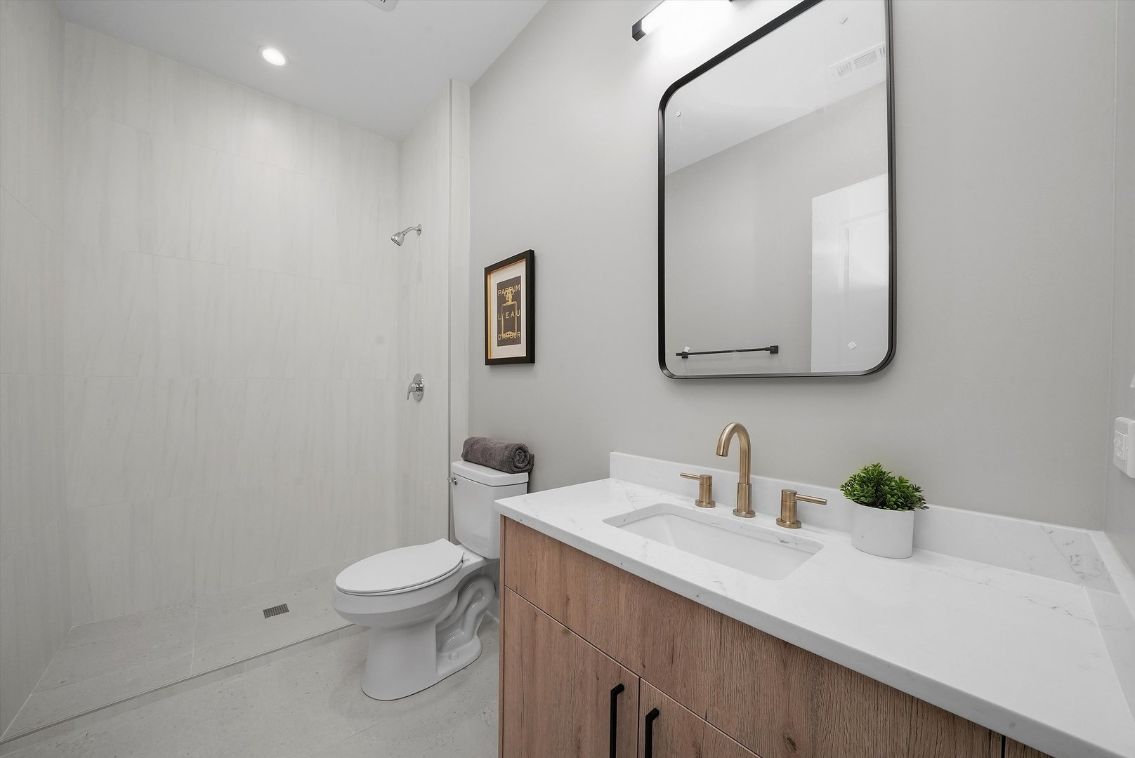 6246 North Pulaski Road, Unit 204 Chicago, IL 60646 - Photo 30 of 38 a bathroom with a sink a toilet and mirror