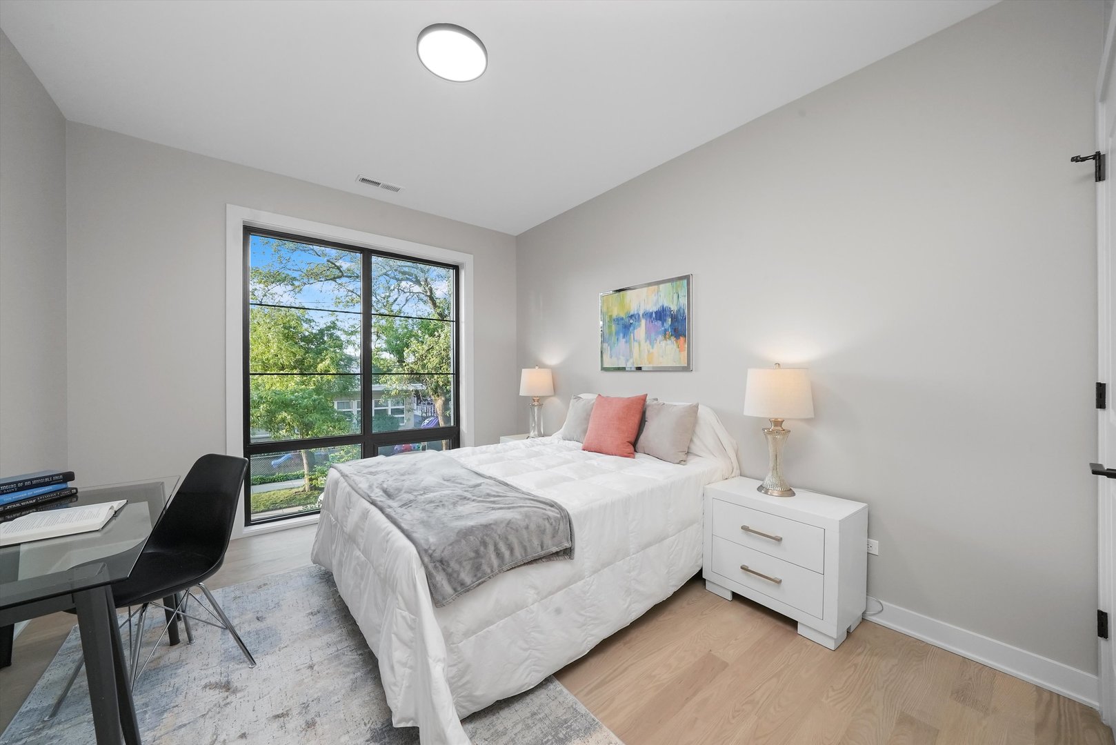 6246 North Pulaski Road, Unit 204 Chicago, IL 60646 - Photo 31 of 38 a bedroom with a bed and a window