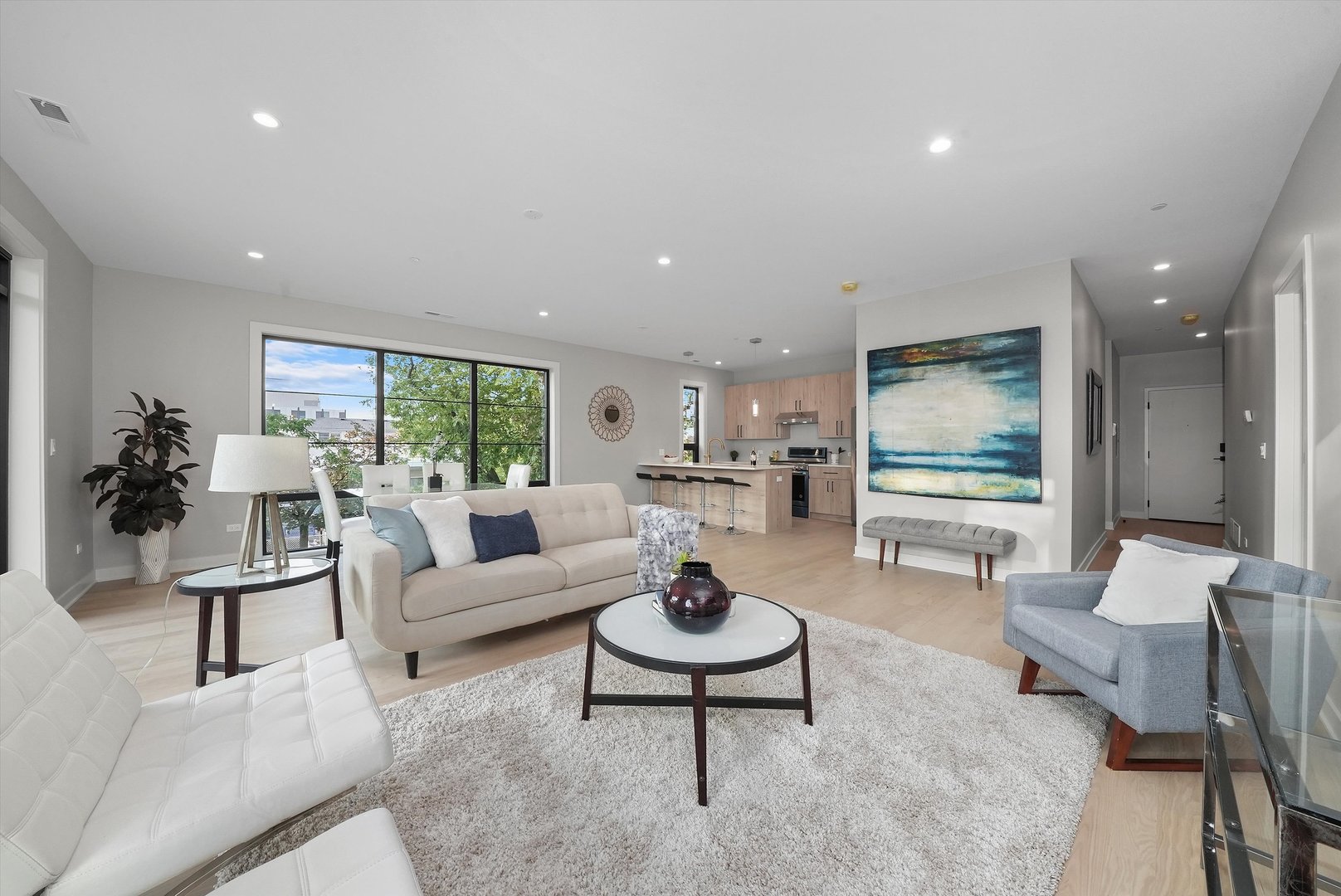 6246 North Pulaski Road, Unit 204 Chicago, IL 60646 - Photo 4 of 38 a living room with furniture and a large window