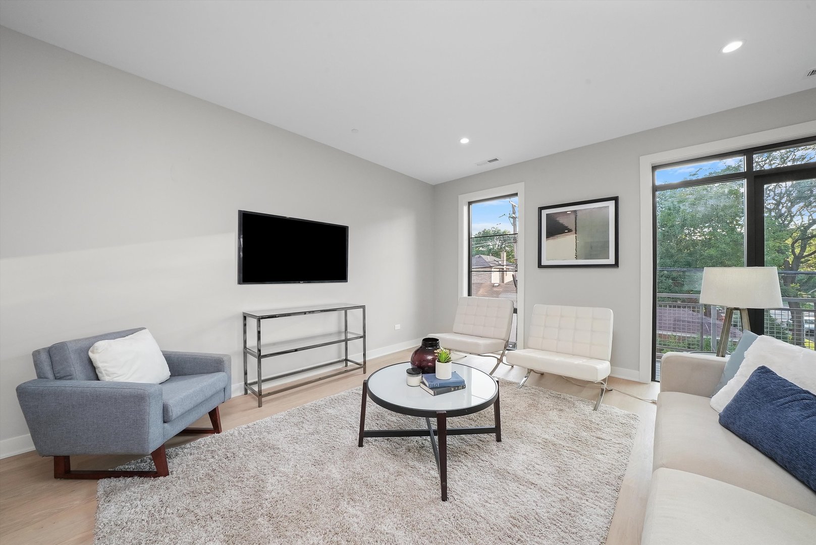 6246 North Pulaski Road, Unit 204 Chicago, IL 60646 - Photo 6 of 38 a living room with furniture and a flat screen tv