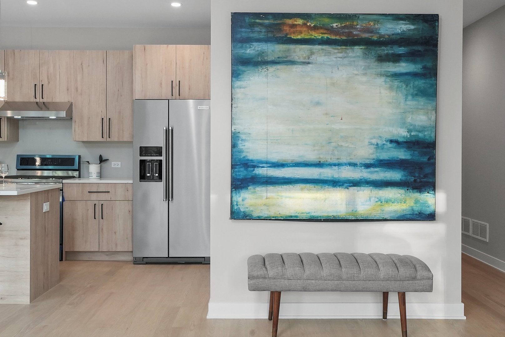 6246 North Pulaski Road, Unit 204 Chicago, IL 60646 - Photo 10 of 38 a kitchen with stainless steel appliances granite countertop a refrigerator a stove and a sink with wooden floor