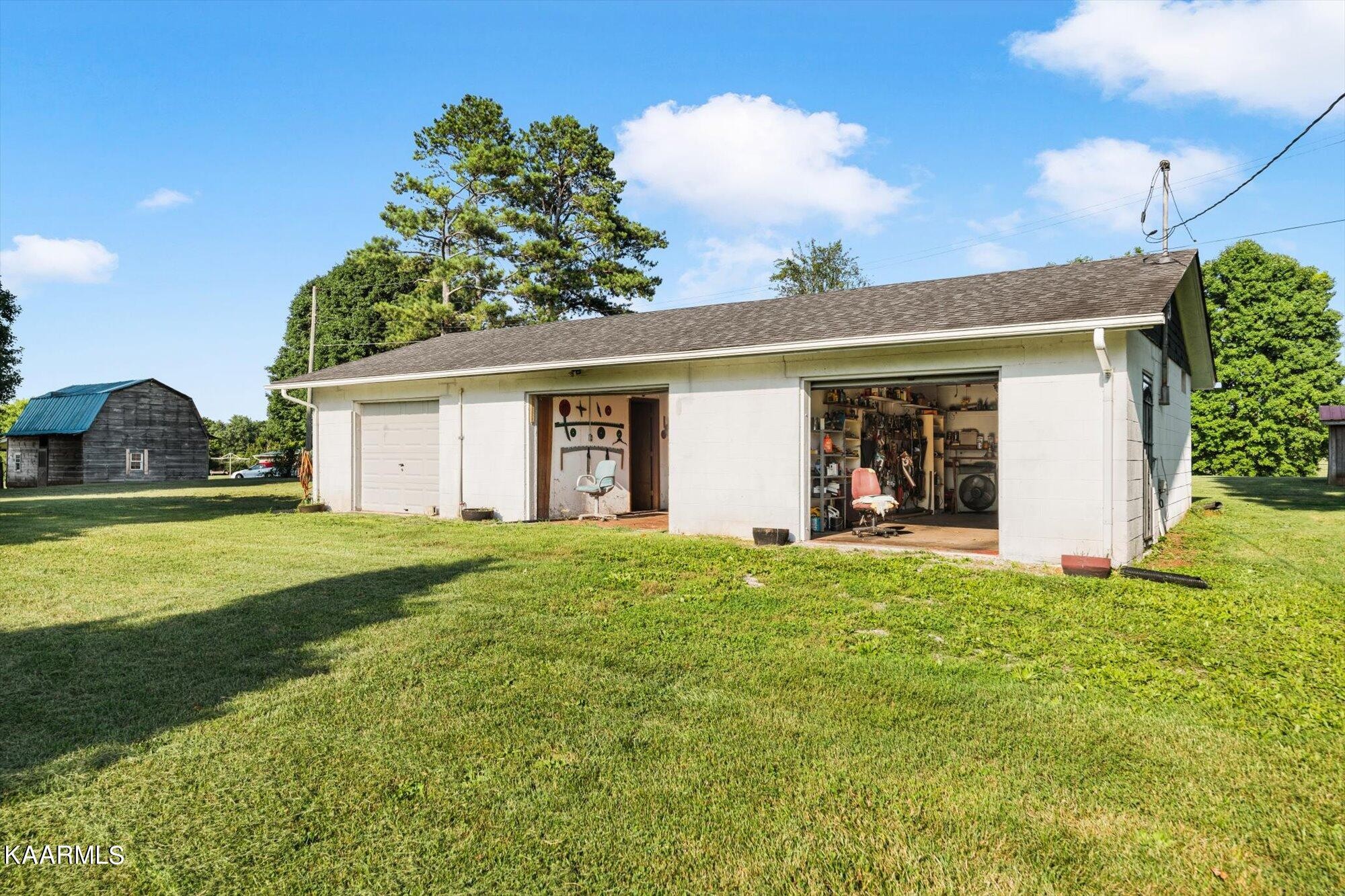 1211 Spring Street Philadelphia, TN 37846 - Photo 22 of 25 a view of a house with backyard and garden