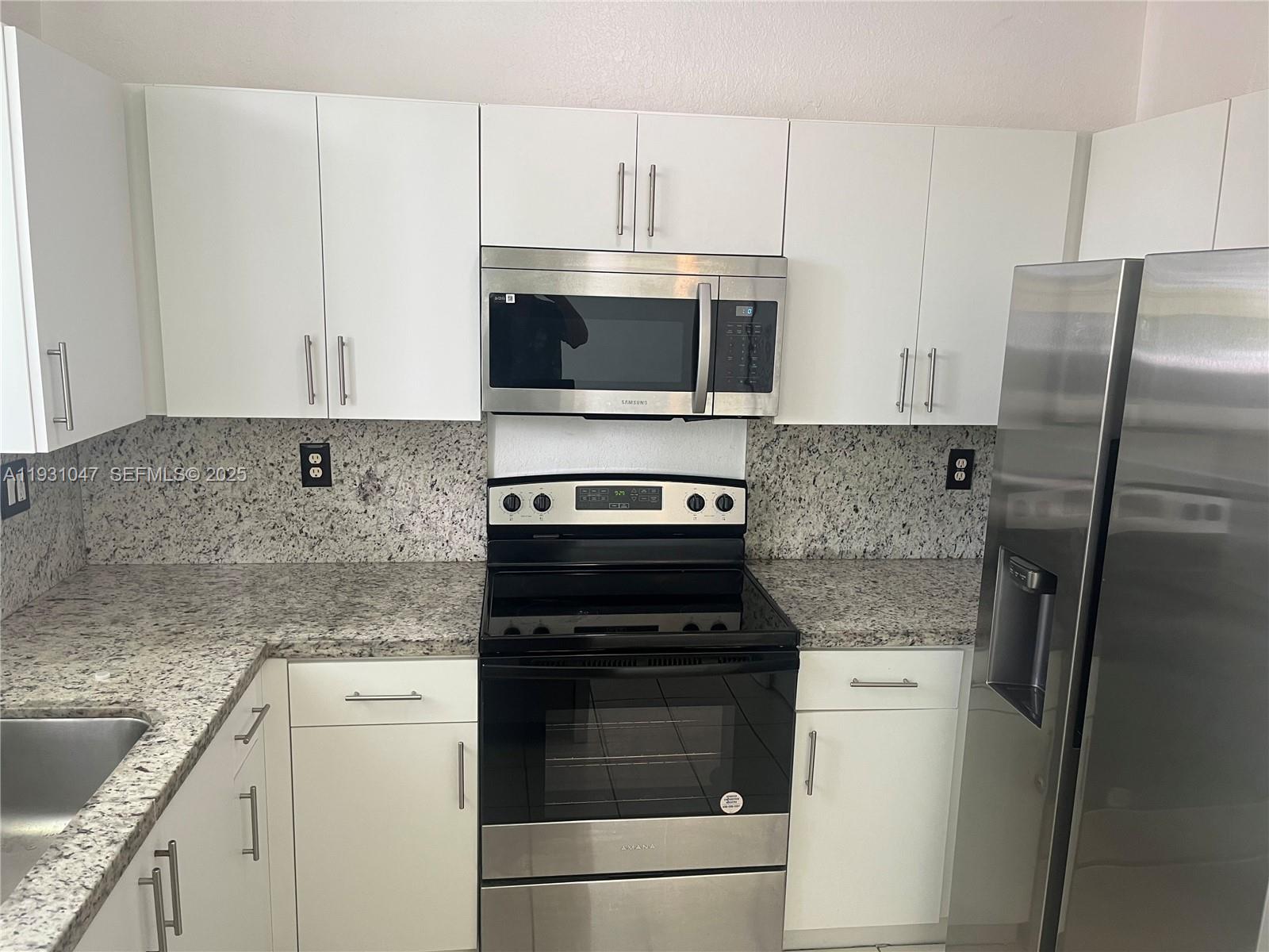 2508 Southeast 14th Avenue, Unit 287 Homestead, FL 33035 - Photo 2 of 17 a kitchen with cabinets stainless steel appliances and a counter top