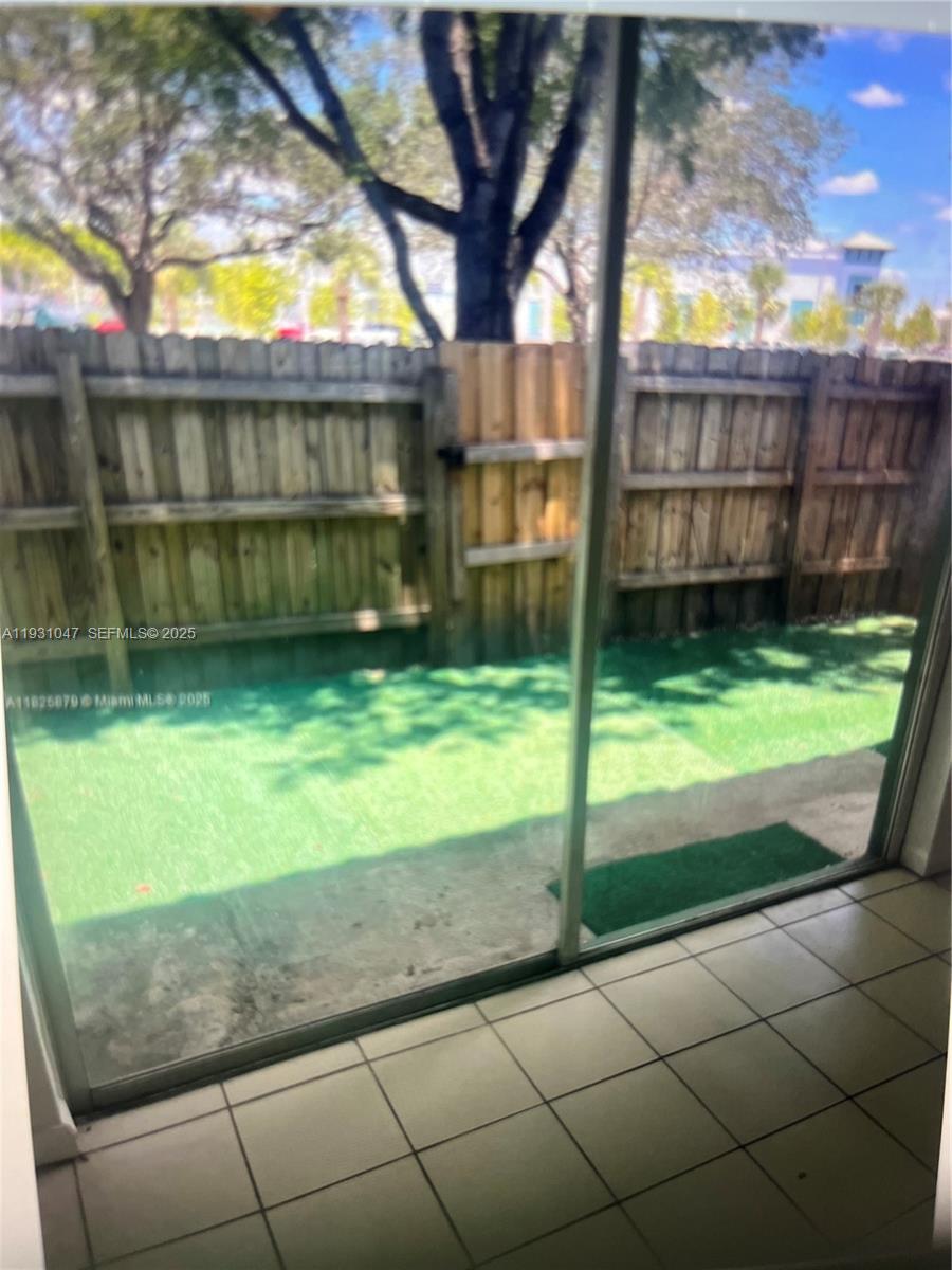 2508 Southeast 14th Avenue, Unit 287 Homestead, FL 33035 - Photo 10 of 17 a view of backyard with tub and trees