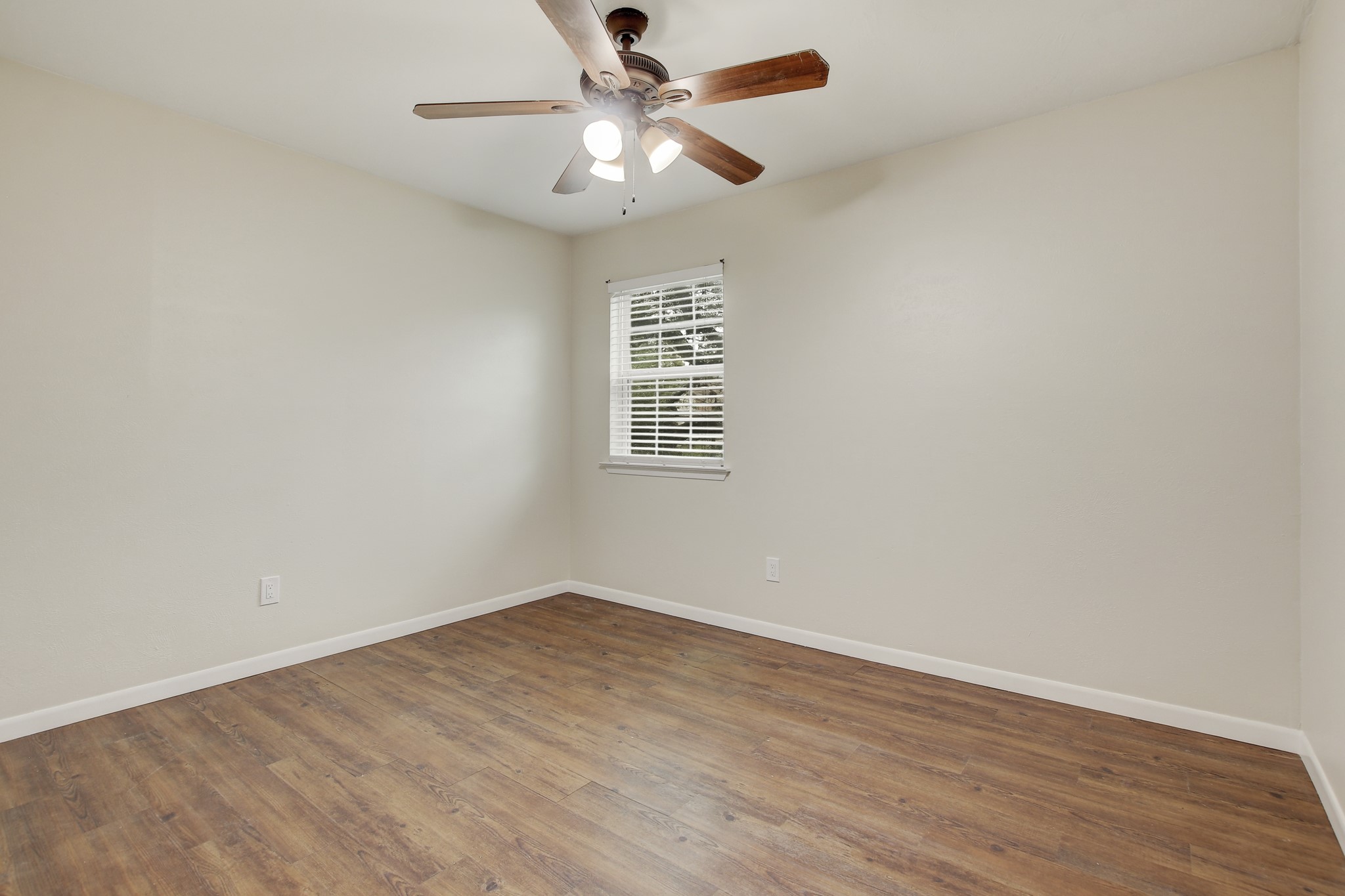 6902 Rifle Bend Austin, TX 78736 - Photo 20 of 33 wooden floor in an empty room with a window