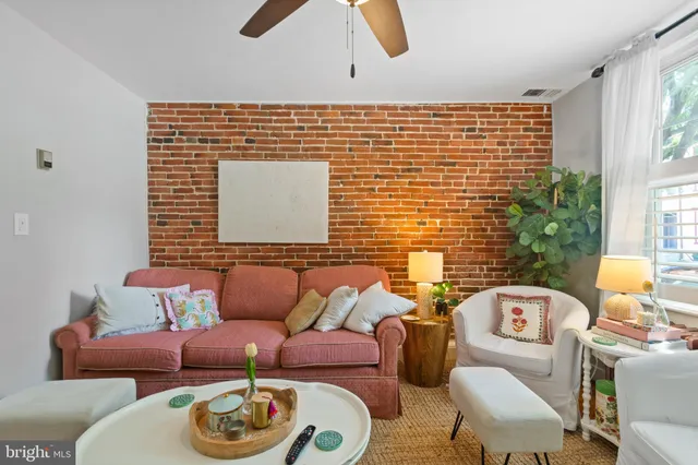 a blue and white room with furniture