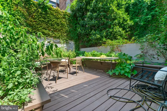 a view of a chairs and table on the wooden deck