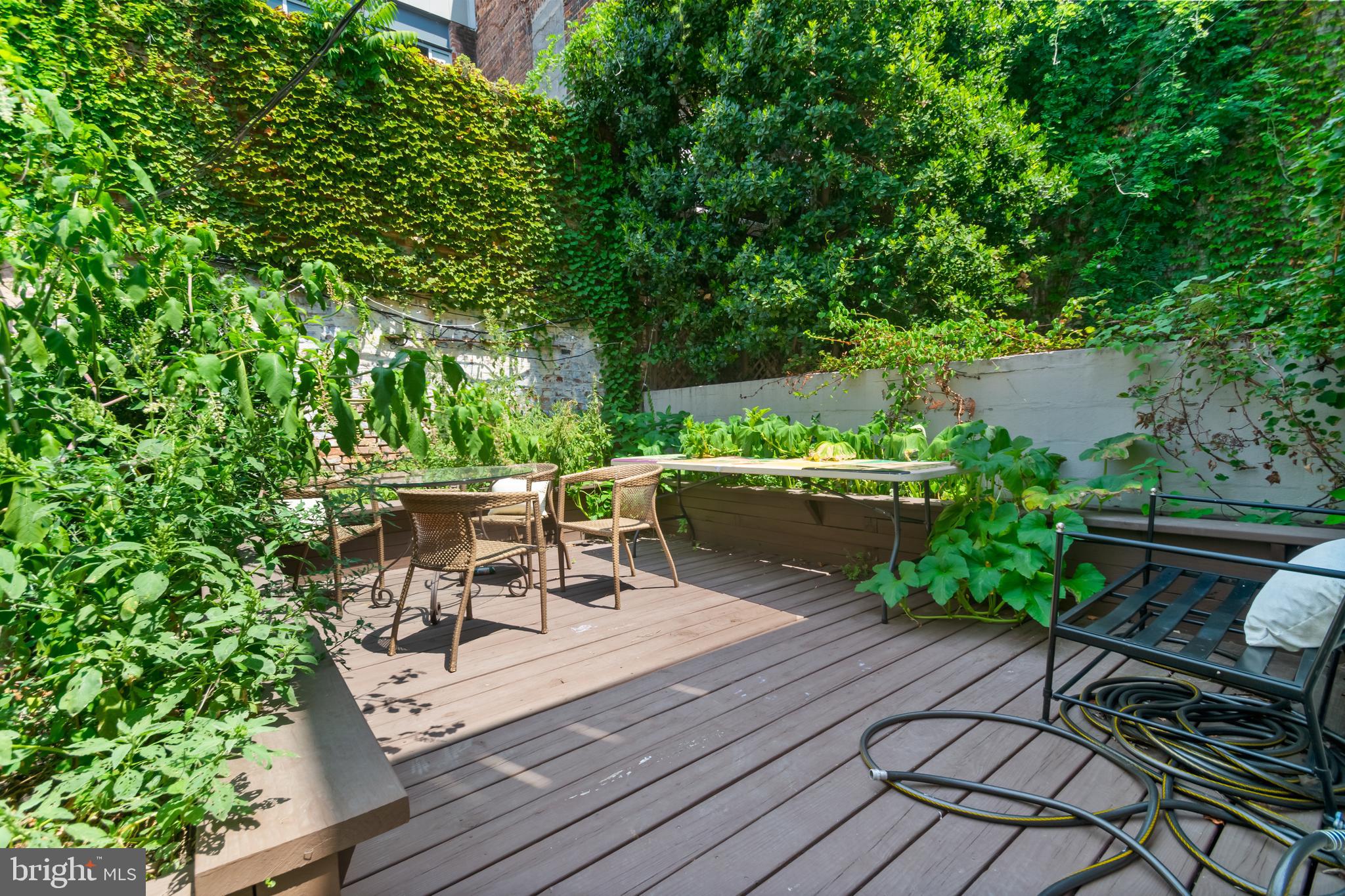 12 East Henrietta Street Baltimore, MD 21230 - Photo 22 of 24 a view of a chairs and table on the wooden deck