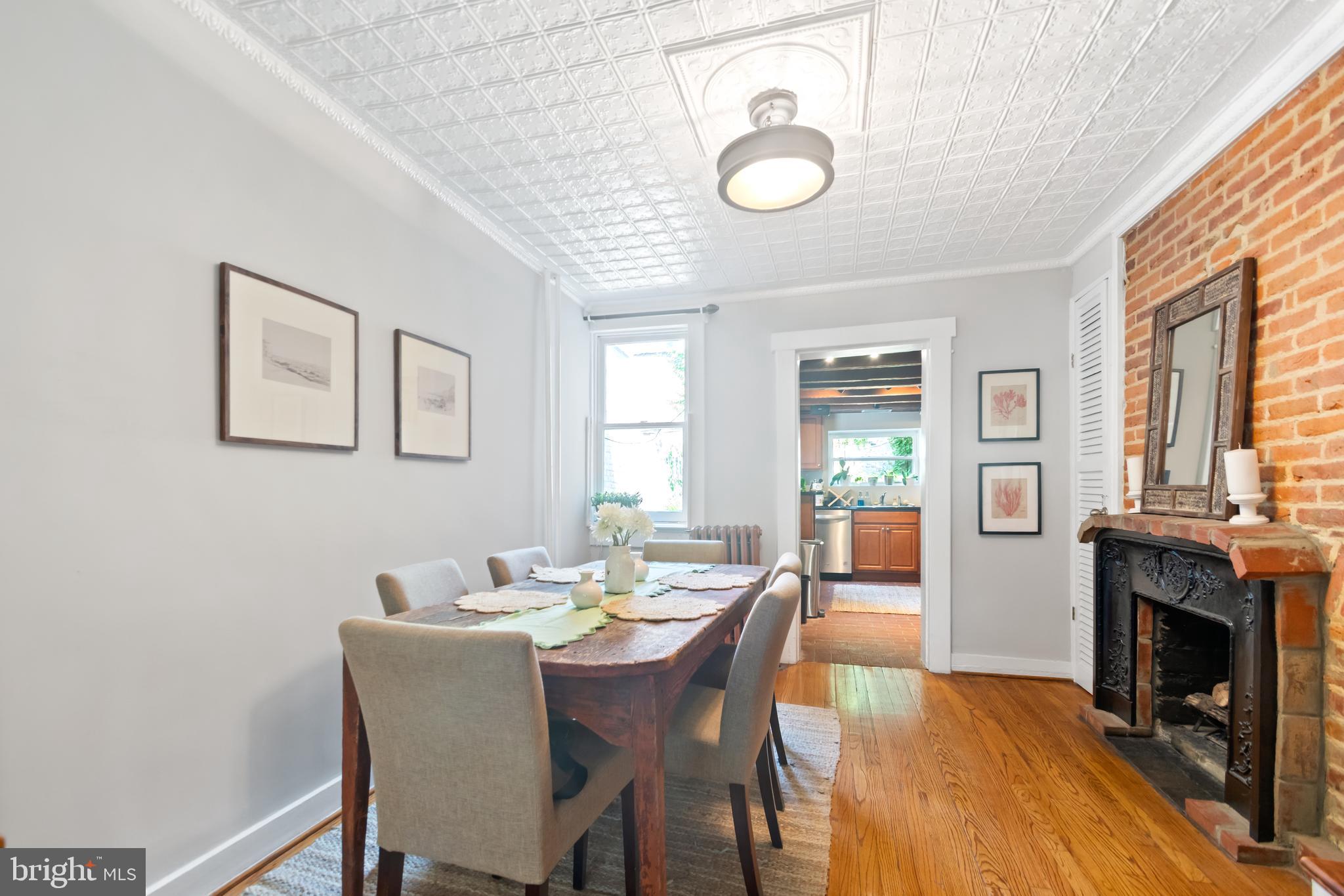 12 East Henrietta Street Baltimore, MD 21230 - Photo 5 of 24 a view of a dining room with furniture window and wooden floor