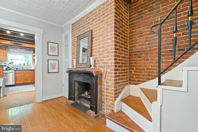 a bedroom with a bed and a fireplace