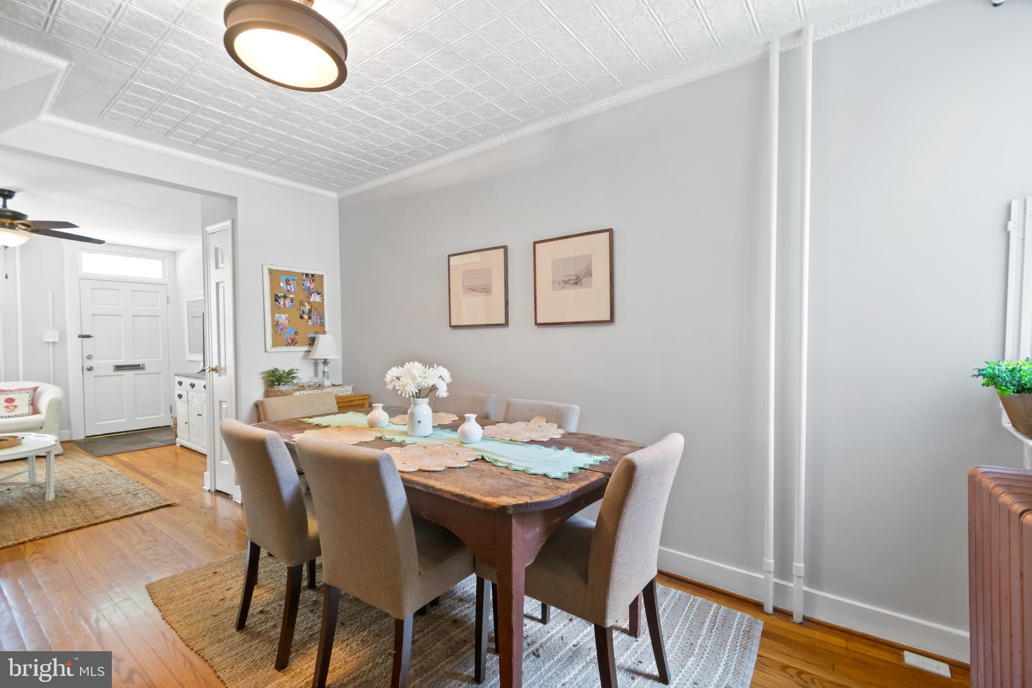 12 East Henrietta Street Baltimore, MD 21230 - Photo 10 of 24 a view of a dining room with furniture and wooden floor