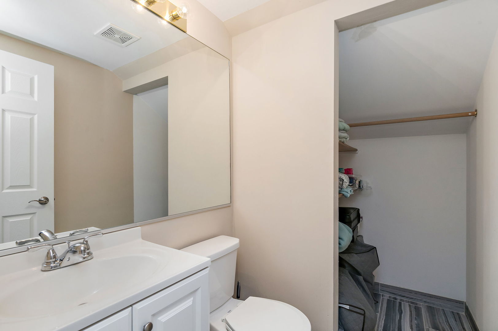 1925 Ozark Parkway Algonquin, IL 60102 - Photo 14 of 17 a bathroom with a sink vanity mirror and toilet