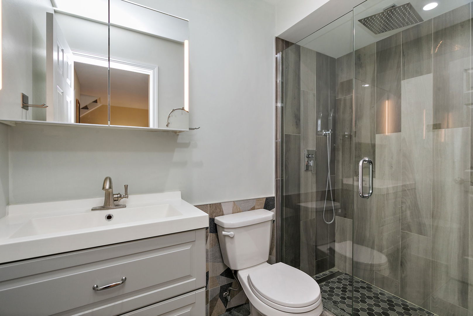 1925 Ozark Parkway Algonquin, IL 60102 - Photo 10 of 17 a bathroom with a sink a toilet and shower
