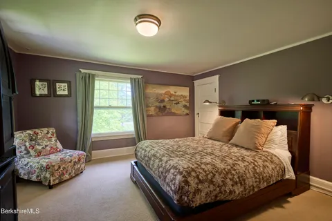 a view of a storage and utility room with washer and dryer