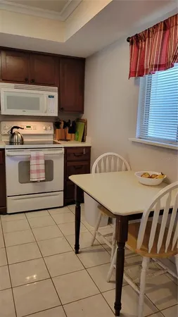 a kitchen with a stove a sink and a refrigerator