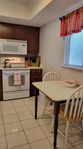 a kitchen with a stove a sink and a refrigerator